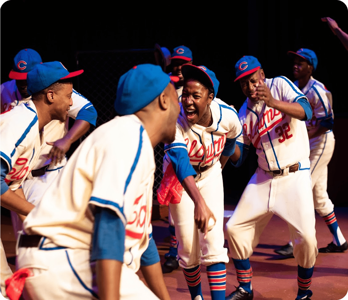 Players in vintage uniforms cheering energetically