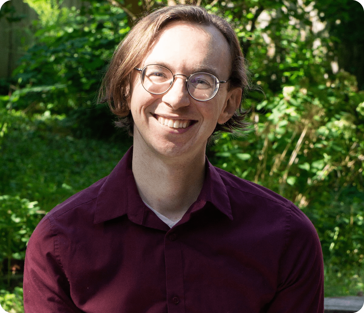Person in maroon shirt smiling